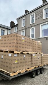 Delivery of six Jacuzzi Lodge hot tubs at Antrim House Portrush, positioned on-site ready for commissioning.