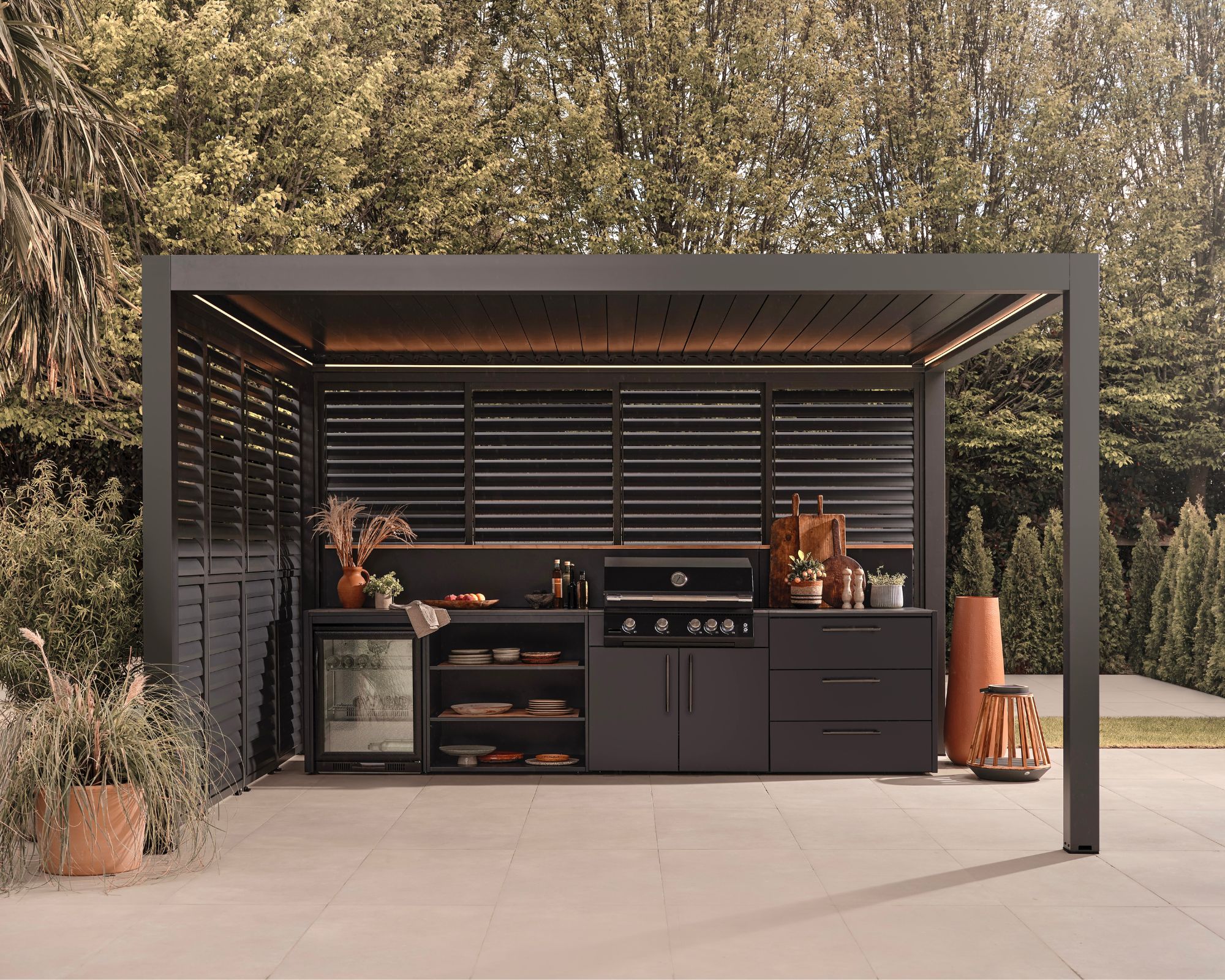Outdoor kitchen setup under a Suns Lifestyle pergola