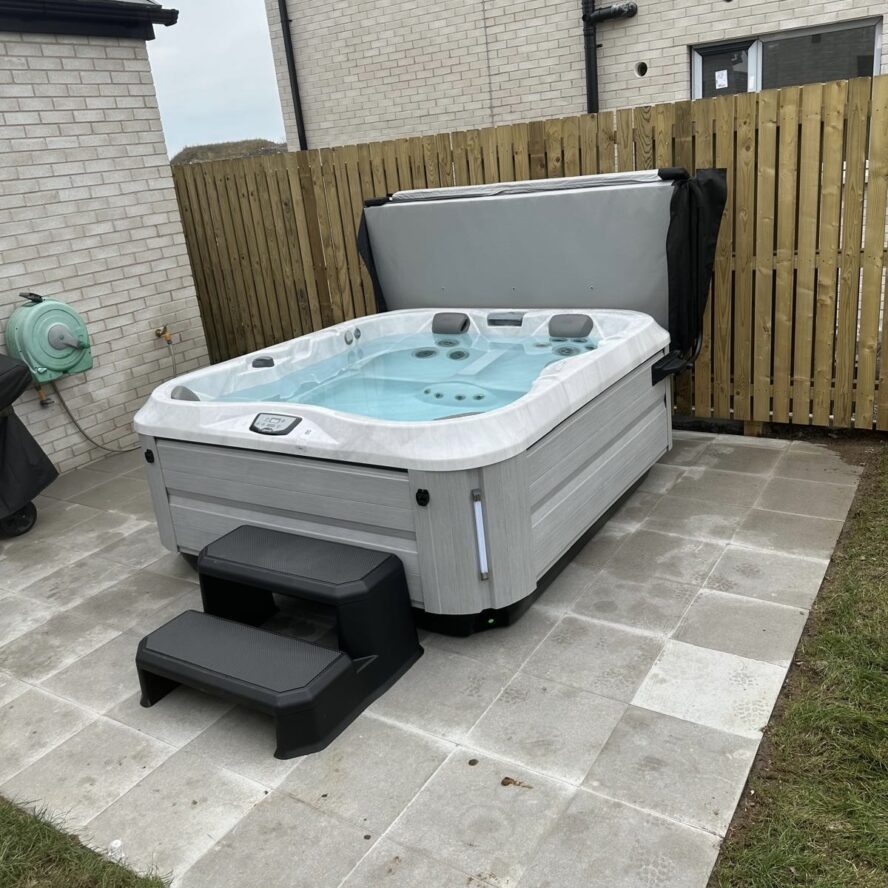 Jacuzzi hot tub installation in Northern Ireland with energy efficient outdoor spa setup